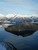 Počas dlhého zjazdu občas prefrčí zrkadlovým fjordom nejaká lodička